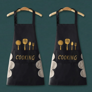 Adjustable black kitchen cooking apron with front pockets for baking, BBQ, chef, and home cooking.