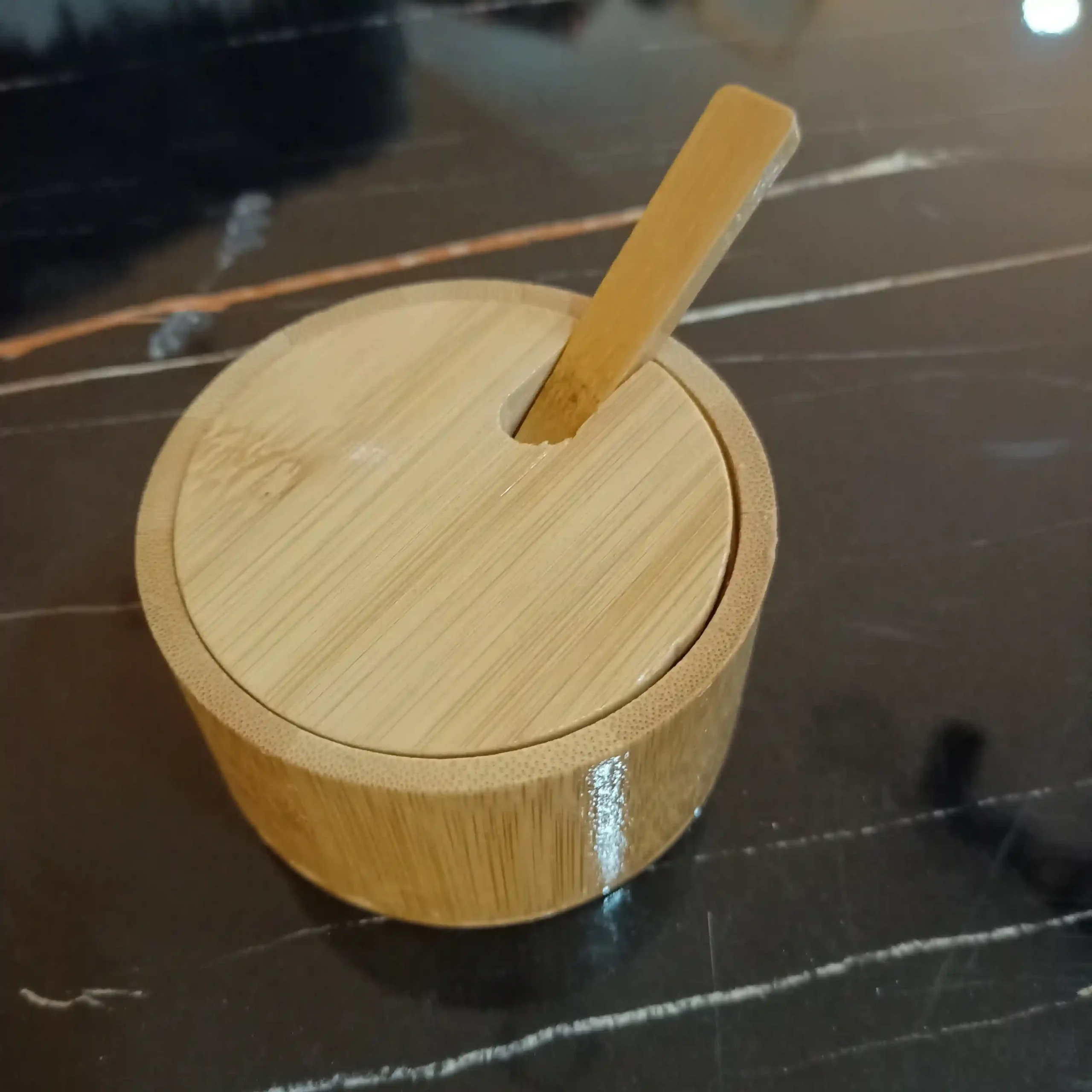 Natural wooden sugar pot container with lid slot and matching wooden spoon shown closed and open with white sugar 1