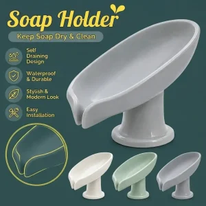 Grey self-draining leaf-shaped soap holder dish mounted beside sink showing automatic drainage spout and color options.