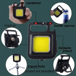 Infographic highlighting features of a black mini COB LED keychain light including carabiner clip, magnet back, bottle opener, 180-degree foldable stand, and tripod hole.