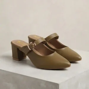 Pair of women's olive green pointed-toe block heel mule pumps with gold buckle straps displayed on a stone pedestal.