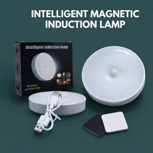 Rechargeable round motion sensor LED night light shown with its retail packaging box, USB charging cable, and magnetic adhesive pads.
